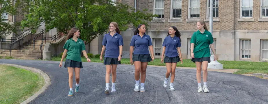a group of MSM students walking together in front of the school