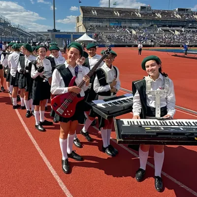 the MSM marching band smiling with their instruments