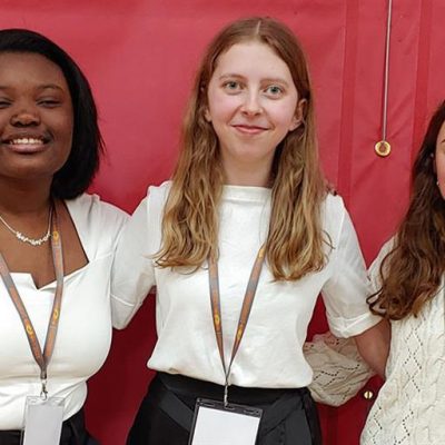 Girls smiling for camera at ECMA event